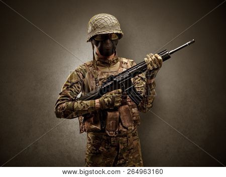 Soldier agent in a dark room with arms on his hand and gas mask