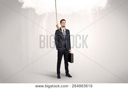 Young businessman trying to suicide with pointing hands concept
