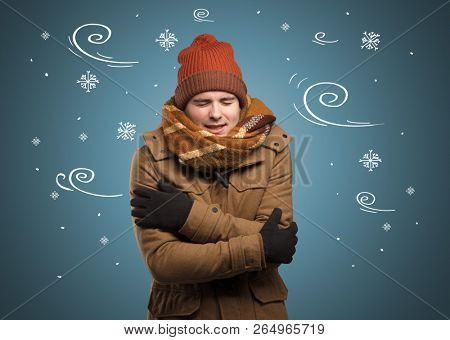 Young hipster frozen boy with doodled snowflakes and windy concept