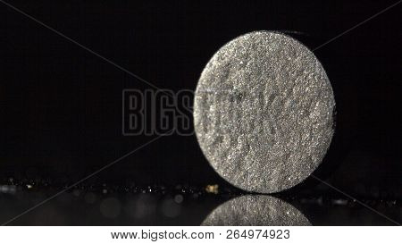 Medical Drug, Black Tablet Activated Carbon On A Black Background In Backlight
