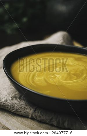 Vegeratian Creamy Soup In Bowl Over Rustic Background, Top View, Healthy Eating Seasonal Food