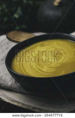 Vegeratian Creamy Soup In Bowl Over Rustic Background, Top View, Healthy Eating Seasonal Food