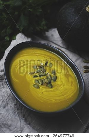 Winter Vegetarian Creamy Seasonal Soup In Bowl Over Rustick Background, Flat Lay Top View, Healthy F