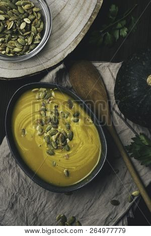 Winter Vegetarian Creamy Seasonal Soup In Bowl Over Rustick Background, Flat Lay Top View, Healthy F