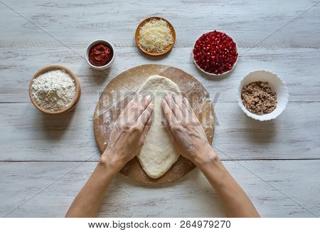 Preparation Of Traditional Arabic Pizza Manaqish With Meat And Pomegranate