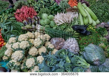 Cauliflower, Broccoli, Carrots, Brijals And Other Vegetables For Sale In A Market In Territy Bazar, 
