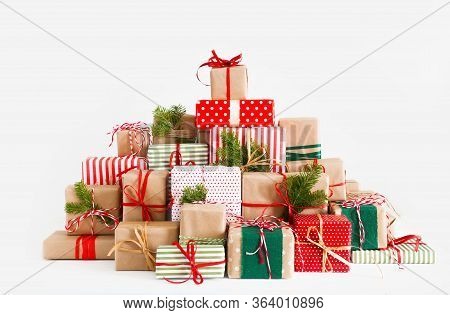 Big Mountain And Lots Of Christmas Gifts. Red, Green And Beige From Kraft Paper.