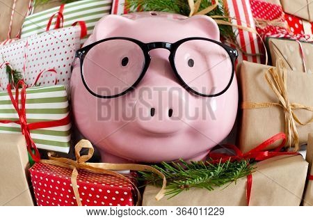 Piggy Bank And A Lot Of Gift Boxes. Christmas Decor. White Background. Fir Branches.