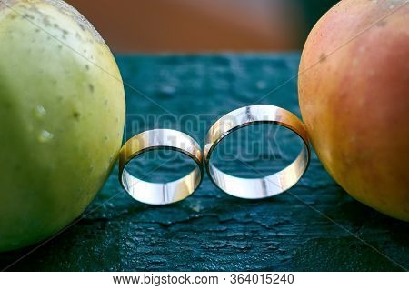 Wedding Rings And Two Apples. Preparing For The Wedding.