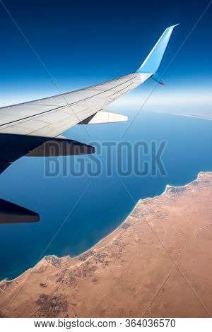 Sahara Desert And Mediterranean Sea Seen From The Plane With The Aircraft Wing, North Coast Of Egypt