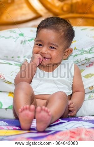 A Asian Baby Boy Doing Fun At Home.