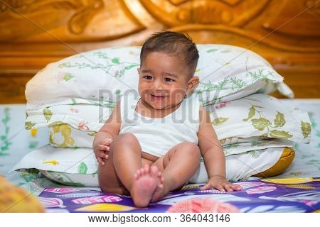 A Asian Baby Boy Doing Fun At Home.