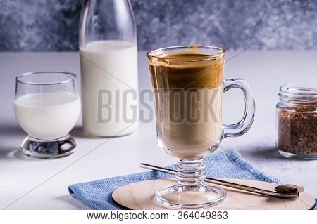 Dalgona Coffee With A Cool Fluffy Whipped Foam On A Gray Background. Dalgona Is A South Korean Drink