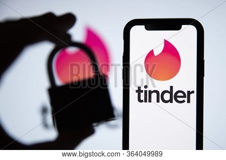London, Uk - April 29 2020: Tinder Dating App Logo On A Phone With Security Lock