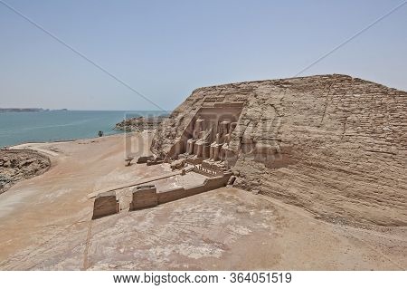 Aerial View Over Exterior Entrance To Ancient Egyptian Temple Of Ramses Ii In Abu Simbel With Giant 