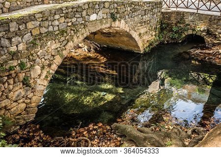 Autumn Landscape With River And Bridge, Livadia, Greece