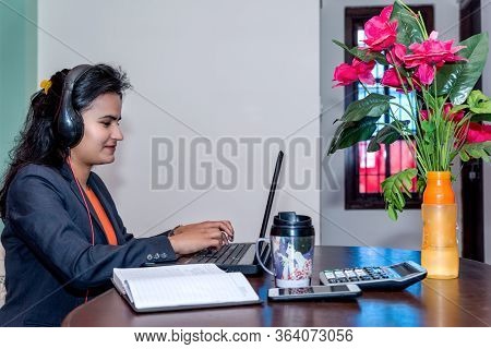 Young Asian Business Woman Working Online From Home In Office Dress With Headphone,smart Phone,calcu