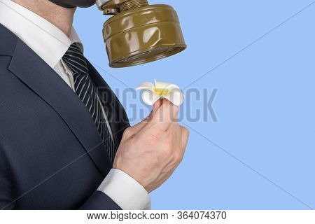 Close Up Portrait Of Man In A Protective Gas Mask With Flower