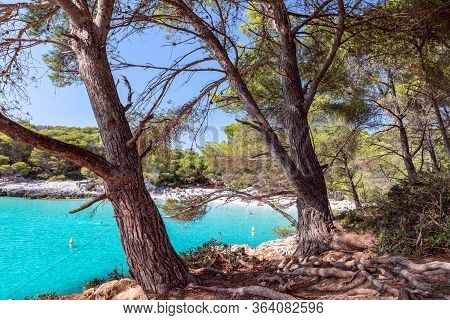 View Of The Famous Beach Cala Turqueta. (focus On Foreground, People On The Beach In Blur). Menorca,