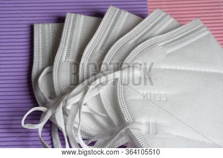 Closeup Of Antivirus Protection Masks Ffp2 Or Kn95 On Colored Background. Prevention For Coronavirus