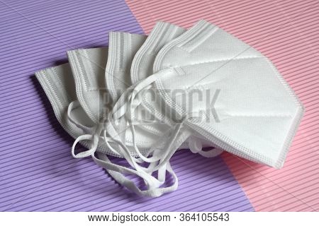 Closeup Of Antivirus Protection Masks Ffp2 Or Kn95 On Colored Background. Prevention For Coronavirus