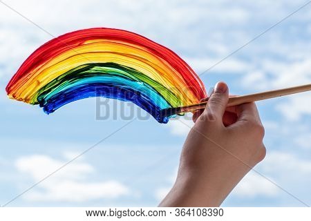 Close-up Of A Hand With A Brush Paints A Rainbow, End Of Quarantine, Self-isolation, Support Of Doct