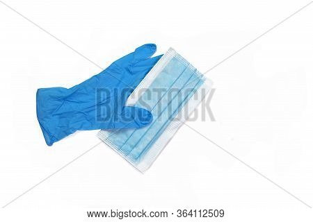 Blue Latex Gloves Holding A Face Mask