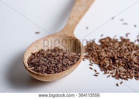 Pile Of Cumin Seeds Isolated On White Background