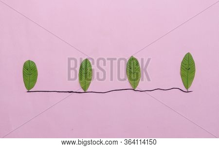 Social Distancing Or Safe Distance Due To Coronavirus Or Covid-19 Conceptual Photo With Leaves Made 