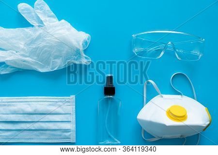 Medical Protective Mask, Respirator Ffp, Rubber Gloves, Antiseptic And Protective Glasses Lie On A P