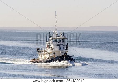 New Bedford, Massachusetts, Usa - April 29, 2020: Tug Sirius Coming Out Of Buzzards Bay On Hazy Morn