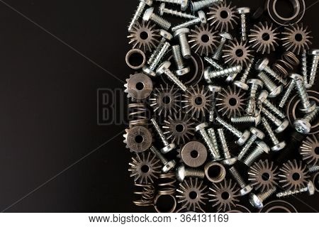 Mechanical Components On Black Background. Industrial Objects