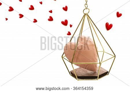 The Red Small Hearts Overflow Around The Pink Heart Enter The Gold Cage, And Fly Upwind.on White Bac