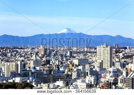 Japan, Tokio, May, 2016 - Aerial View Of Tokyo City Overlooking Mount Fuji. Tokyo Is The Capital Cit