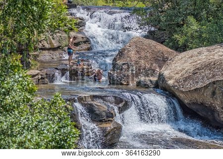 Royal Natal National Park, South Africa - March 8, 2020: Fathers Playing With Their Children In The 