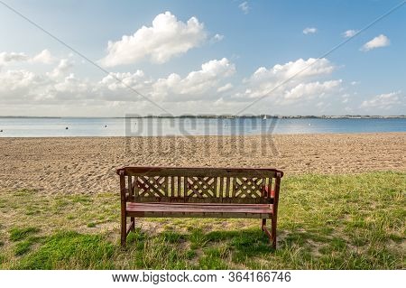 Lonely Bench Facing Beautiful Beach At The Baltic Sea In Northern Germany