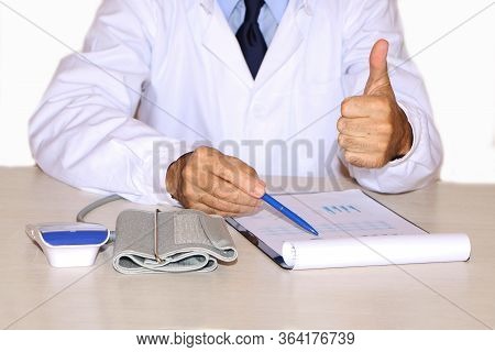 Close-up - The Doctor Sits At The Table And Writes The History Of The Patient's Pain