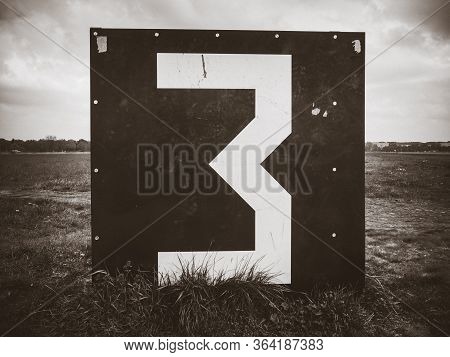 Number 3 Countdown Panel On Templehof Airport Runway, Berlin, Germany. Black And White Picture