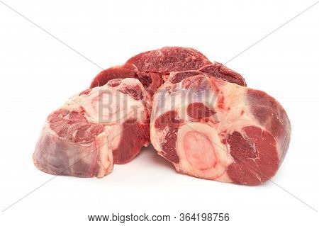 Three Slices Of Fresh Shank Steak On A White Background. Fresh Osso Buco Steaks.