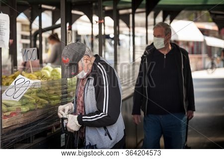 Belgrade, Serbia - April 28, 2020: Old Senior Men Wearing A Respiratory Face Masks Waiting In Queue 