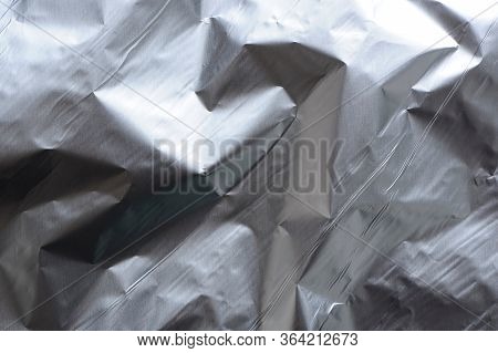 Slightly Crumpled Metal Foil Texture As Background