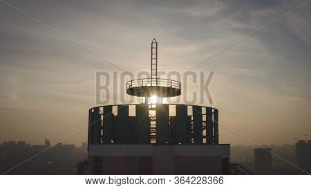 Silhouette Of A Roof Spire. Sunset And Evening City Center