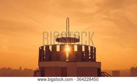 Silhouette Of A Roof Spire. Sunset And Evening City Center