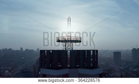 Silhouette Of A Roof Spire. Sunset And Evening City Center