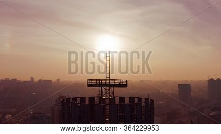 Silhouette Of A Roof Spire. Sunset And Evening City Center