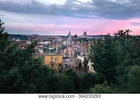 Panoramic View Across Rooftops Of Rome And St Peter's At Magenta Sunset, Rome, Italy