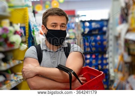 Man Buyer Wearing A Protective Mask.shopping During The Pandemic.emergency To Buy List.panic Buying 