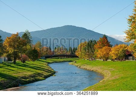 Sunny Autumn Day By The River In Bavarian Alps