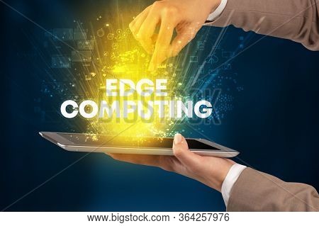 Close-up of a touchscreen with EDGE COMPUTING inscription, innovative technology concept