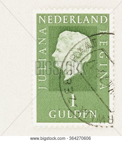 Seattle Washington - May 1, 2020: 1981 Green Regina Stamp Of Netherlands Featuring Queen Juliana. Sc